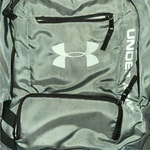 Under Armour grey back pack with black zippers and white lettering.